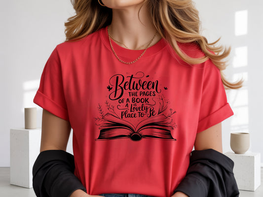 "Between the Pages of a Book Is a Lovely Place to Be" — Floral Literary Graphic Tee | Gift for Readers