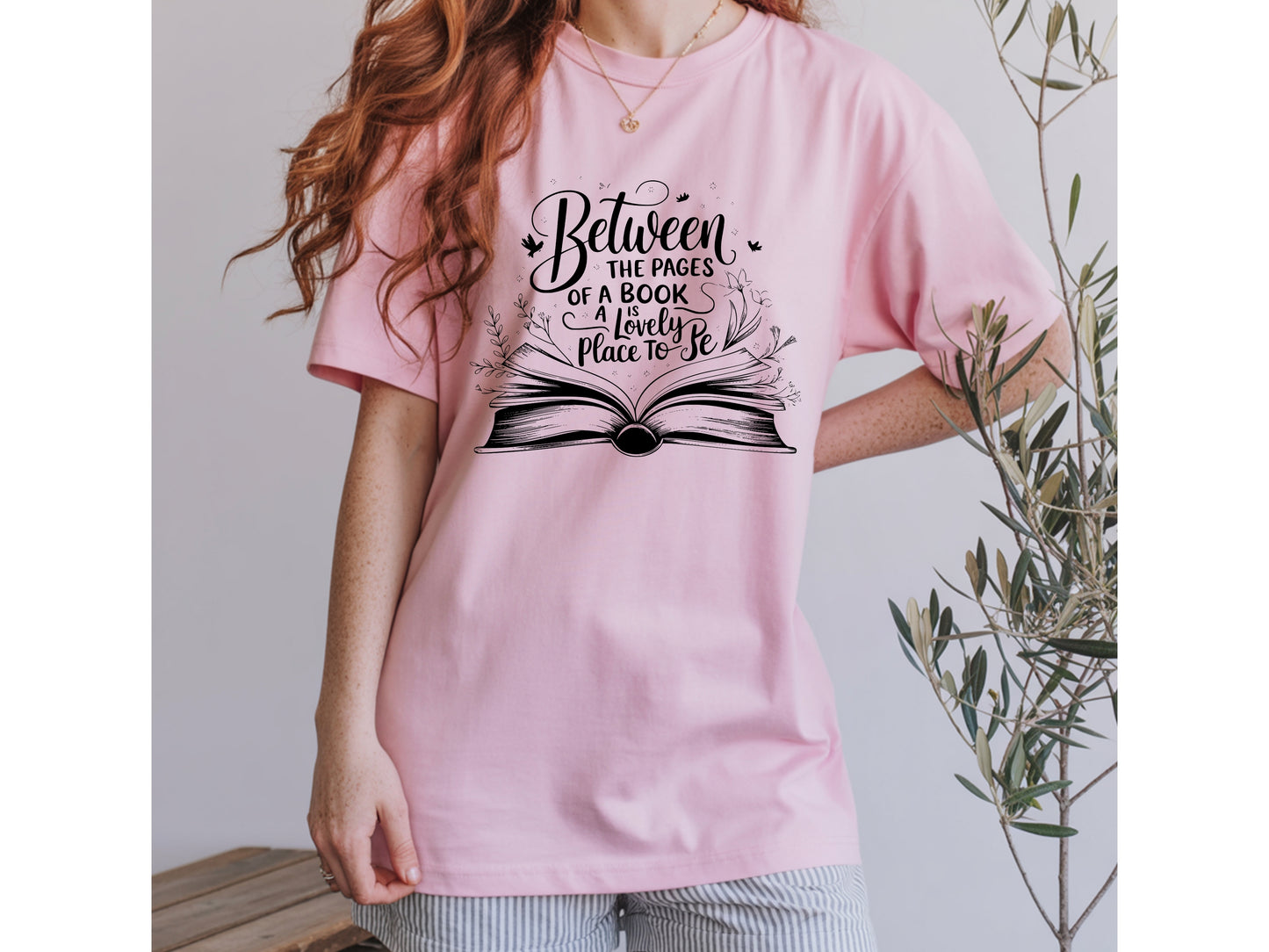 "Between the Pages of a Book Is a Lovely Place to Be" — Floral Literary Graphic Tee | Gift for Readers