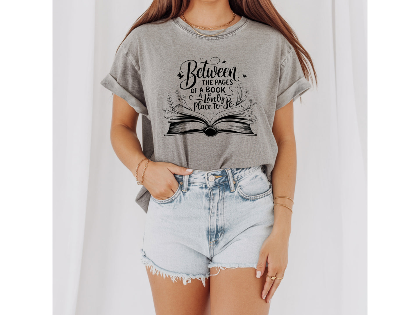 "Between the Pages of a Book Is a Lovely Place to Be" — Floral Literary Graphic Tee | Gift for Readers