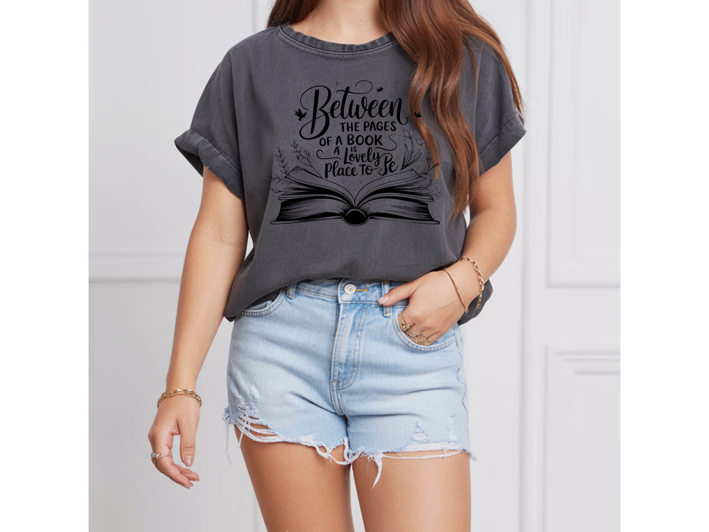 "Between the Pages of a Book Is a Lovely Place to Be" — Floral Literary Graphic Tee | Gift for Readers